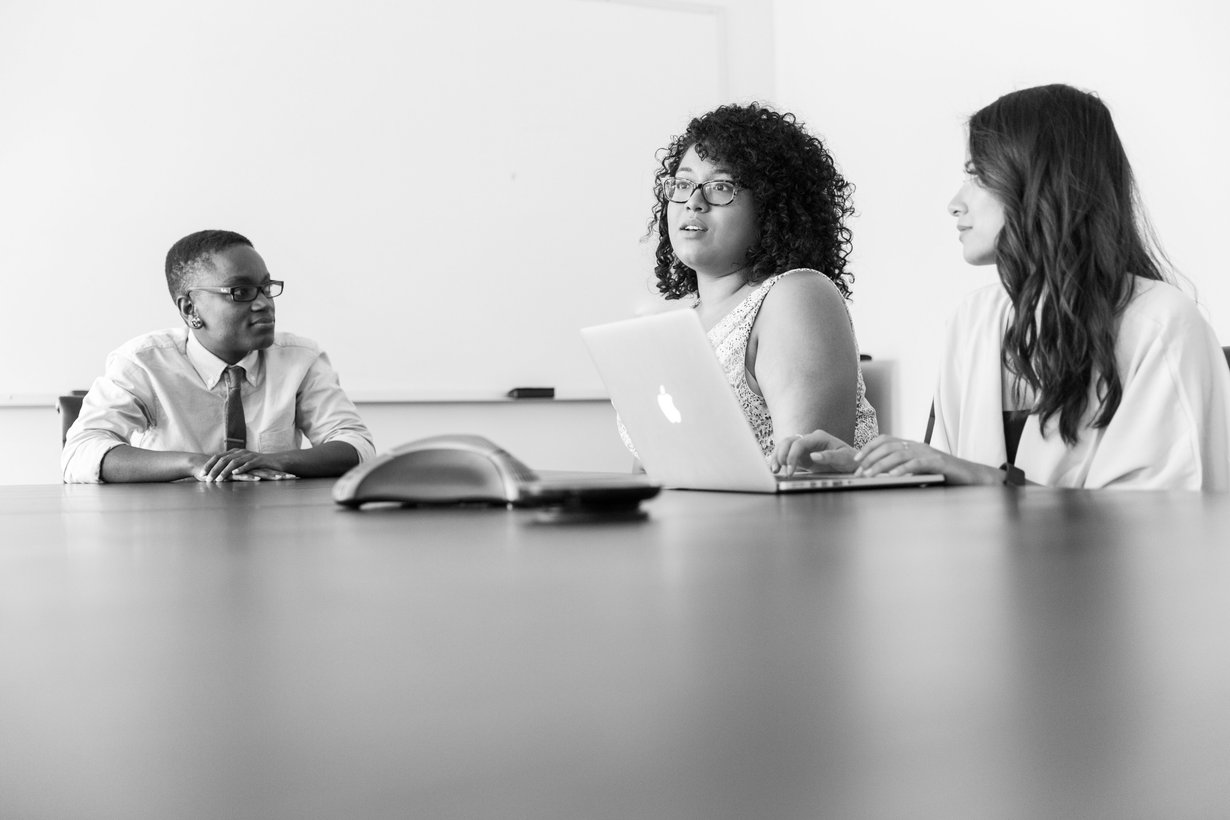 Modern office boardroom where automated workflows run behind the scenes